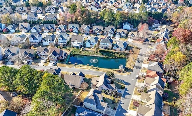 bird's eye view with a water view and a residential view