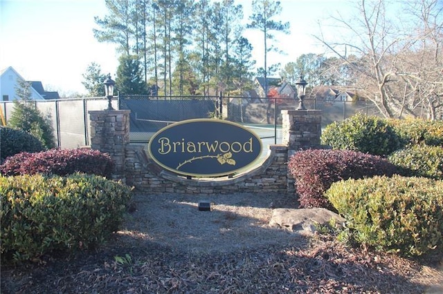 community sign with fence