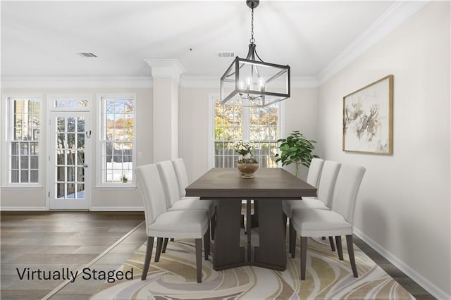 dining room with visible vents, baseboards, an inviting chandelier, and wood finished floors
