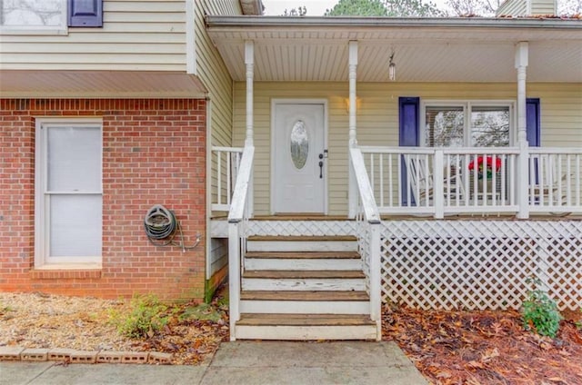 property entrance with covered porch