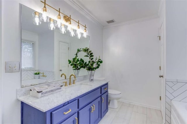 bathroom featuring ornamental molding, toilet, vanity, and a tub