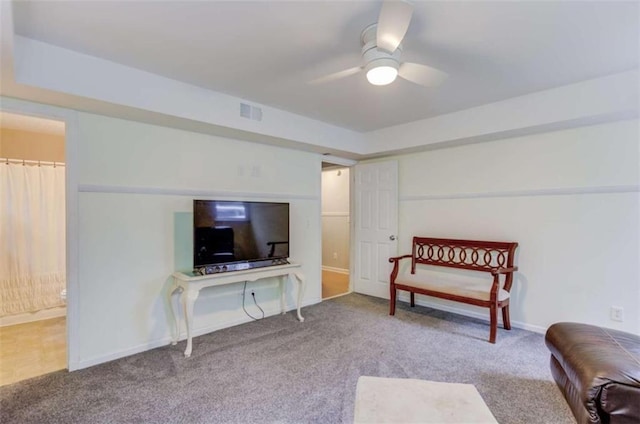 sitting room with carpet floors and ceiling fan