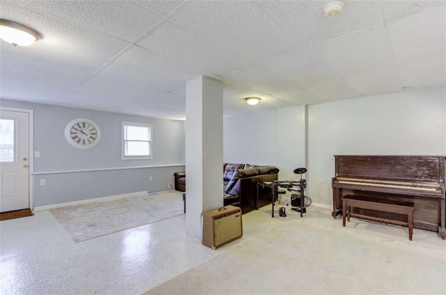 basement featuring a paneled ceiling