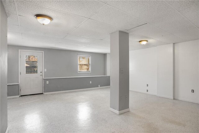 basement featuring a drop ceiling