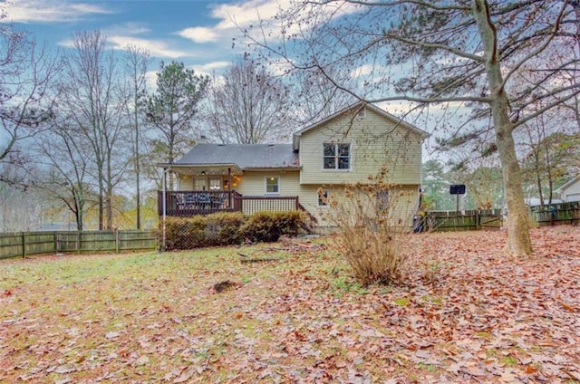 rear view of house featuring a deck