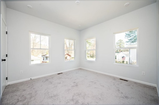 1005 Sims Ave NW, Atlanta, GA 30318 - carpeted spare room with baseboards and visible vents