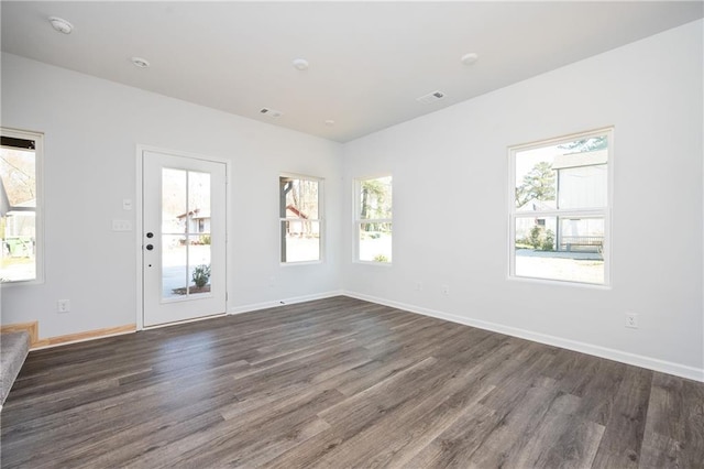 1005 Sims Ave NW, Atlanta, GA 30318 - unfurnished living room with baseboards, dark wood-style floors, and visible vents