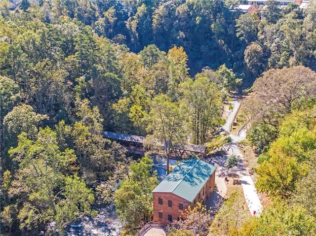 view from above of property with a forest