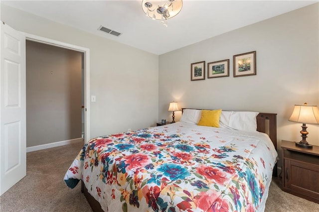 bedroom with carpet flooring, baseboards, and visible vents