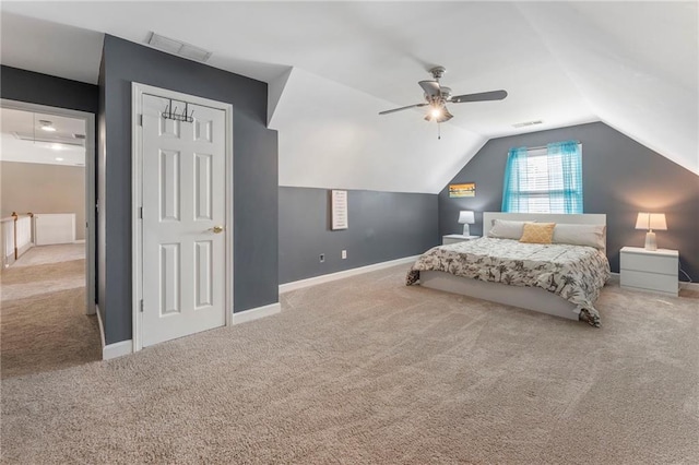 bedroom with visible vents, a ceiling fan, carpet floors, and vaulted ceiling