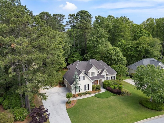 aerial view featuring a wooded view