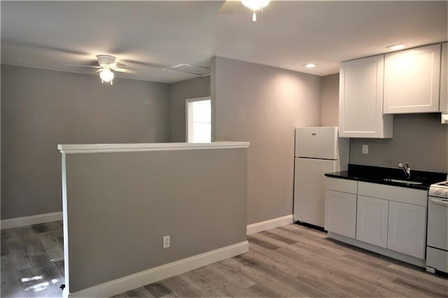 2054 E Roxboro Rd NE, Atlanta, GA 30324 - kitchen with white cabinetry, a ceiling fan, dark countertops, and white appliances