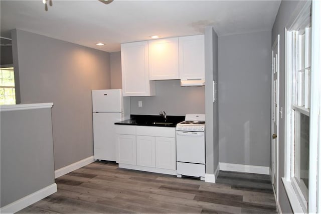 2054 E Roxboro Rd NE, Atlanta, GA 30324 - kitchen featuring white appliances, baseboards, under cabinet range hood, dark wood finished floors, and white cabinets