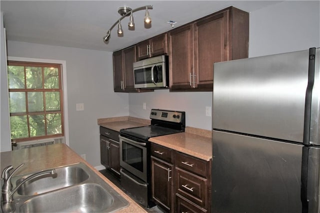 2054 E Roxboro Rd NE, Atlanta, GA 30324 - kitchen with a sink, dark brown cabinets, and appliances with stainless steel finishes