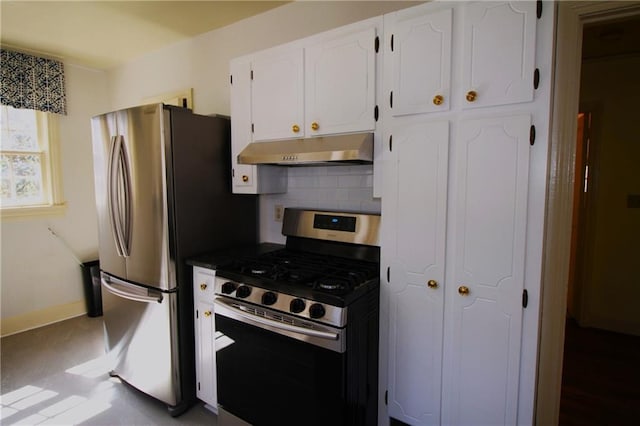 2054 E Roxboro Rd NE, Atlanta, GA 30324 - kitchen featuring tasteful backsplash, under cabinet range hood, dark countertops, white cabinets, and appliances with stainless steel finishes