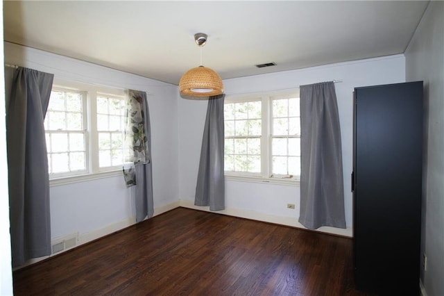 2054 E Roxboro Rd NE, Atlanta, GA 30324 - spare room featuring plenty of natural light, visible vents, and dark wood-style flooring