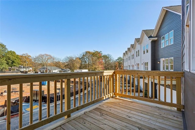 wooden deck with a residential view