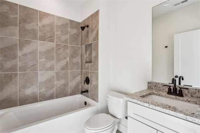 bathroom featuring tub / shower combination, visible vents, toilet, and vanity