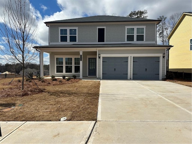 view of front of property featuring a garage and a porch