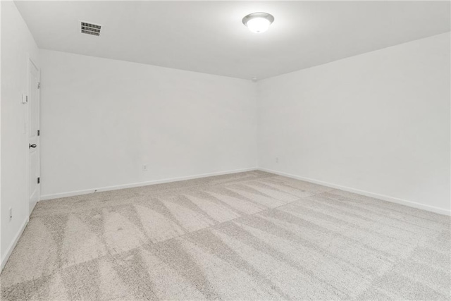 unfurnished room with light colored carpet