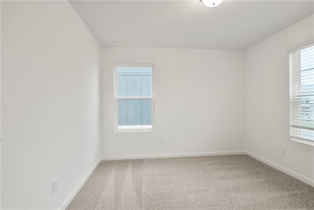 unfurnished room featuring carpet floors