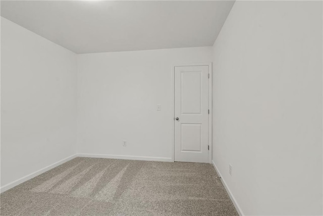 spare room featuring carpet floors