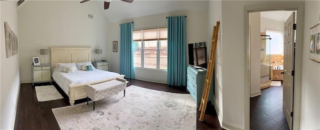 bedroom featuring vaulted ceiling, visible vents, and dark wood-style flooring