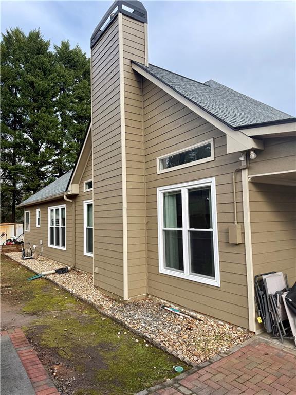 view of home's exterior featuring a shingled roof