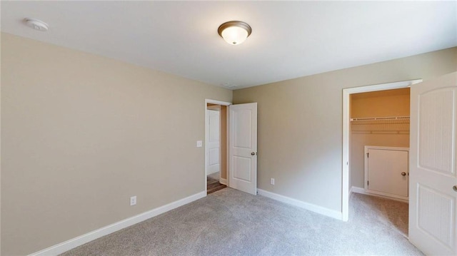 113 Cherokee Estates Dr, Cedartown, GA 30125 - unfurnished bedroom featuring a spacious closet, light carpet, and a closet