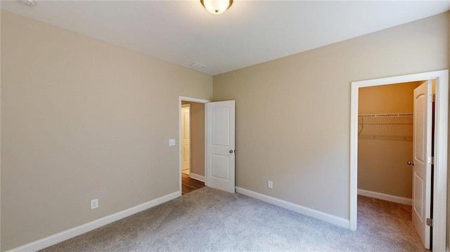 113 Cherokee Estates Dr, Cedartown, GA 30125 - unfurnished bedroom with carpet floors, a walk in closet, and a closet
