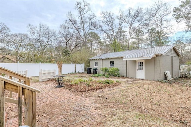 back of property featuring a patio