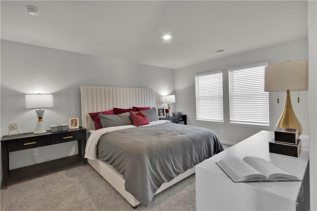 bedroom featuring recessed lighting, light carpet, visible vents, and baseboards