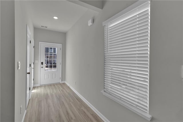 entryway featuring light wood finished floors, recessed lighting, visible vents, and baseboards