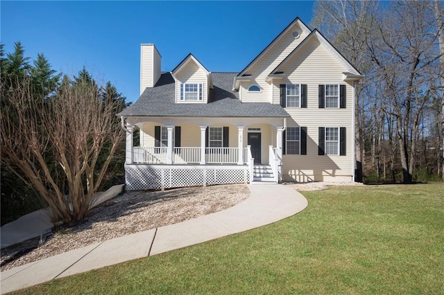 274 Sleepy Hollow Rd, Powder Springs, GA 30127 - view of front of house featuring covered porch, a chimney, and a front lawn