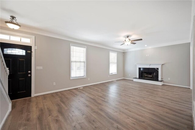 274 Sleepy Hollow Rd, Powder Springs, GA 30127 - unfurnished living room featuring wood finished floors, ornamental molding, baseboards, and ceiling fan