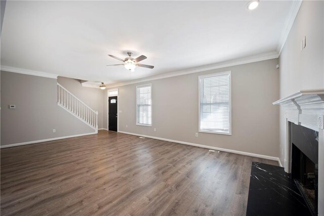 274 Sleepy Hollow Rd, Powder Springs, GA 30127 - unfurnished living room featuring a ceiling fan, ornamental molding, and baseboards