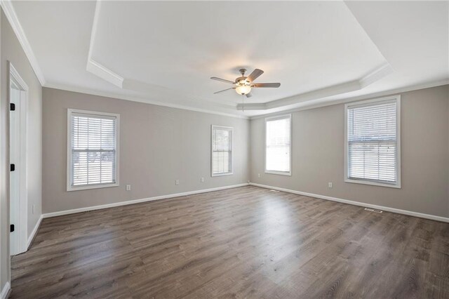 274 Sleepy Hollow Rd, Powder Springs, GA 30127 - spare room featuring baseboards, dark wood-type flooring, a ceiling fan, and a raised ceiling