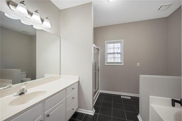 274 Sleepy Hollow Rd, Powder Springs, GA 30127 - full bath with tile patterned flooring, vanity, toilet, baseboards, and a stall shower
