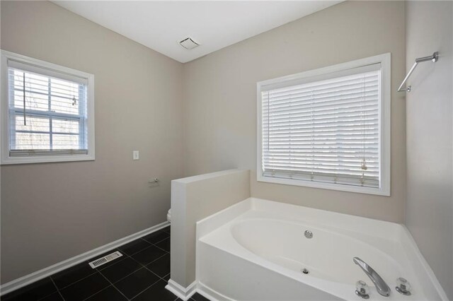 274 Sleepy Hollow Rd, Powder Springs, GA 30127 - bathroom with tile patterned flooring, visible vents, baseboards, and a bath