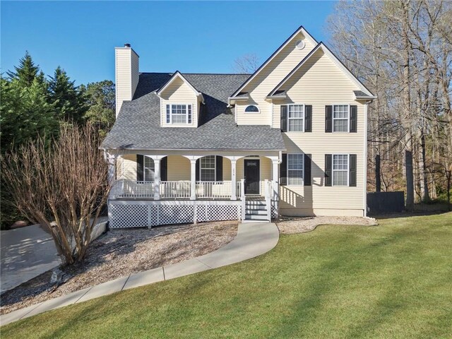 274 Sleepy Hollow Rd, Powder Springs, GA 30127 - traditional home with covered porch, a front yard, a shingled roof, and a chimney