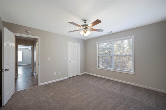 274 Sleepy Hollow Rd, Powder Springs, GA 30127 - unfurnished bedroom featuring attic access, multiple windows, visible vents, and carpet flooring