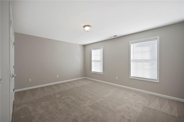 274 Sleepy Hollow Rd, Powder Springs, GA 30127 - empty room with baseboards, visible vents, and light carpet