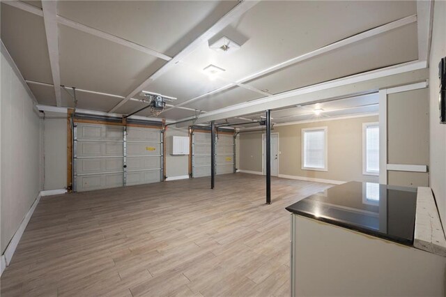 274 Sleepy Hollow Rd, Powder Springs, GA 30127 - garage featuring baseboards and a garage door opener