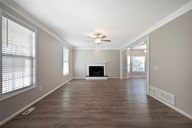 274 Sleepy Hollow Rd, Powder Springs, GA 30127 - unfurnished living room featuring dark wood-style floors, visible vents, ornamental molding, and a ceiling fan