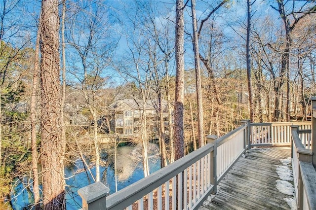 wooden terrace with a water view