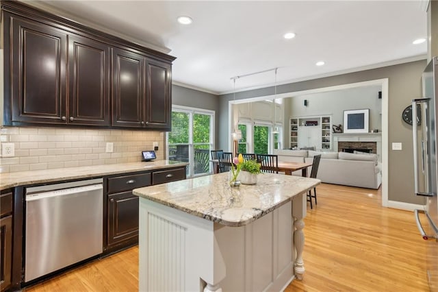 6795 Preston Glen Dr, Alpharetta, GA 30005 - kitchen with stainless steel appliances, ornamental molding, light wood-style flooring, tasteful backsplash, and dark brown cabinets