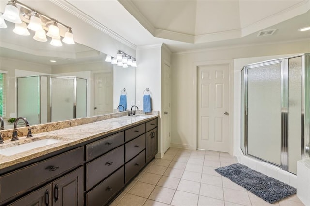 6795 Preston Glen Dr, Alpharetta, GA 30005 - bathroom with a tray ceiling, ornamental molding, a shower stall, double vanity, and tile patterned floors