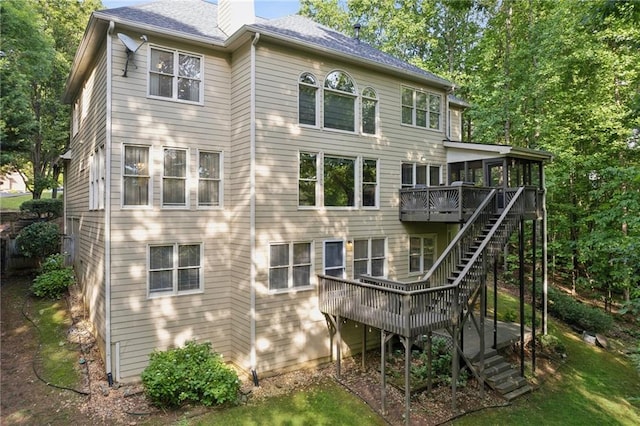 6795 Preston Glen Dr, Alpharetta, GA 30005 - back of house featuring stairs, a sunroom, a wooden deck, a chimney, and roof with shingles