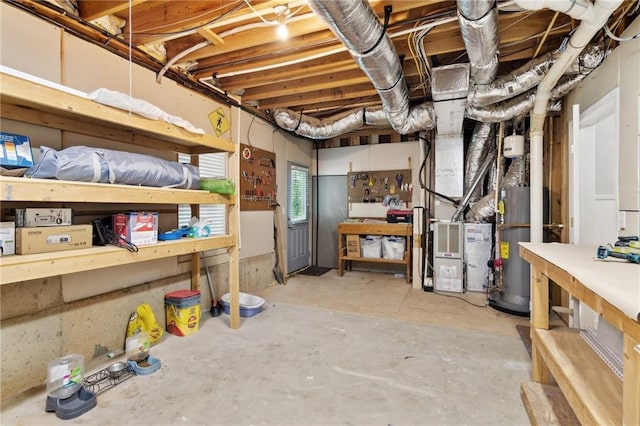 6795 Preston Glen Dr, Alpharetta, GA 30005 - basement with gas water heater, heating unit, and a workshop area