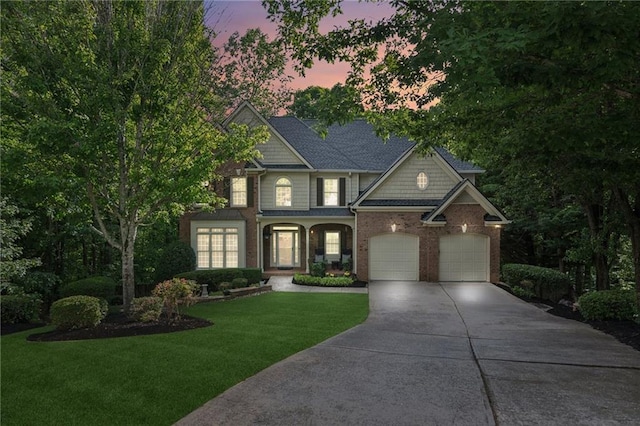 6795 Preston Glen Dr, Alpharetta, GA 30005 - view of front of property with driveway, a lawn, a garage, and brick siding